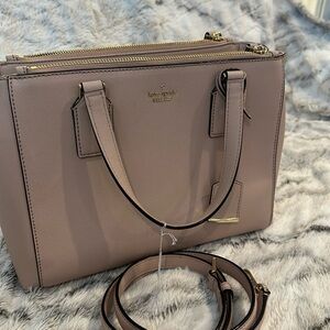 Kate spade Handbag in excellent condition. Comes with straps. 12.5L x 9"H x 5W.
